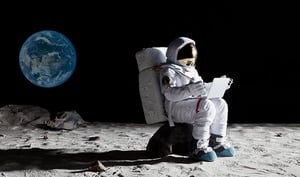 astronaut-sitting-moon-laptop